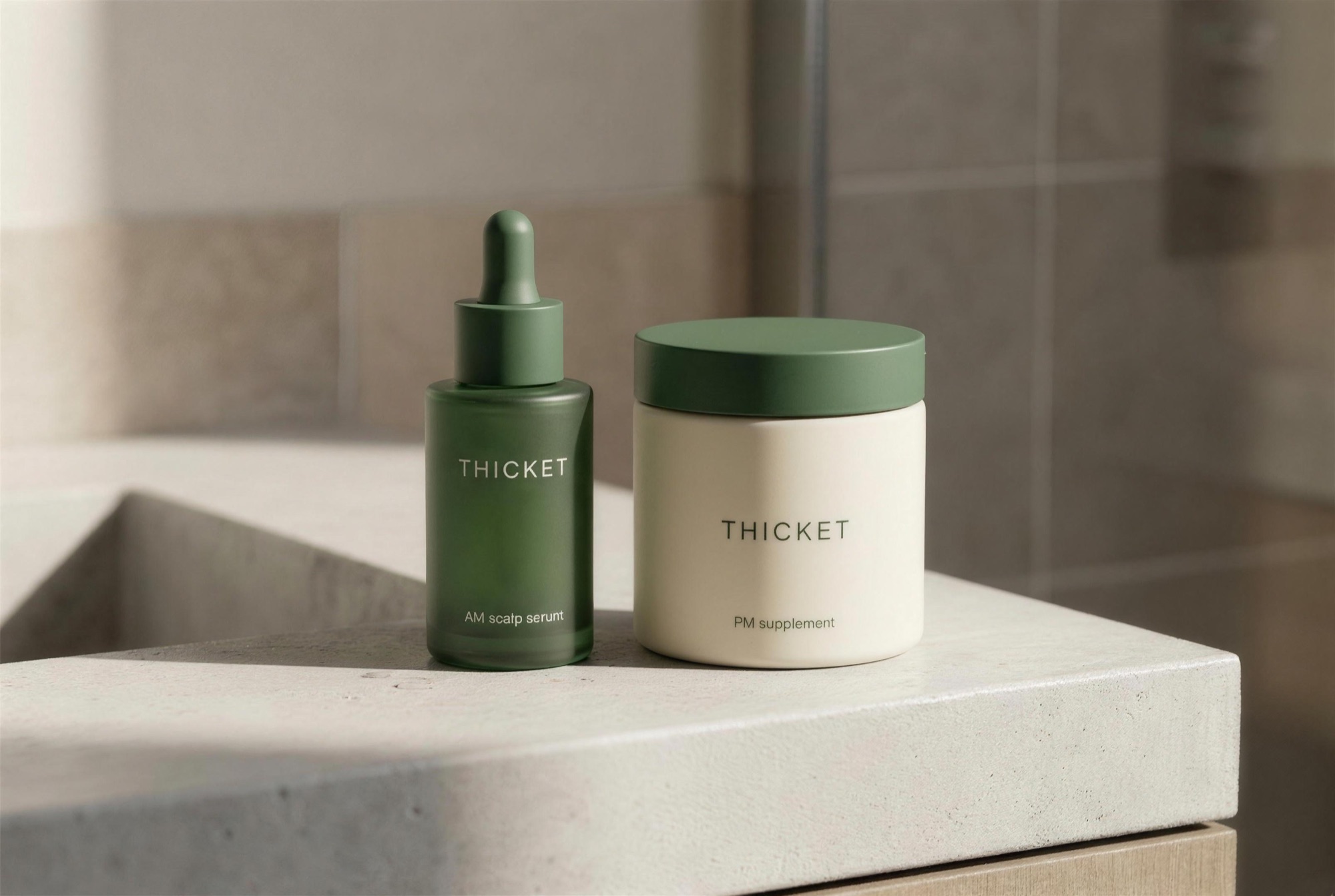 The Thicket two-step hair system: AM scalp serum and PM density supplement on a bathroom counter